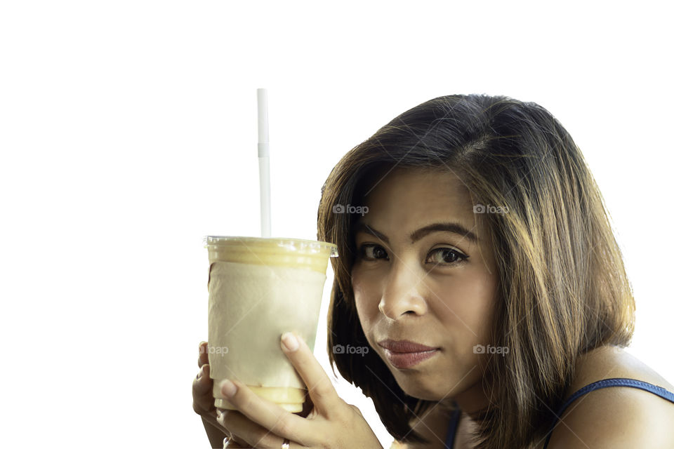 Asian woman holding glass of iced coffee on a white background with clipping path.