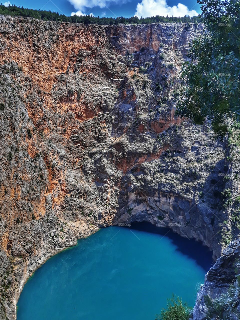 Red Lake - Imotski, Croatia
It is known for its numerous caves and remarkably high cliffs, reaching over 241 metres above normal water level and continuing below the water level. The total explored depth of this sinkhole is approximately 530 metres.