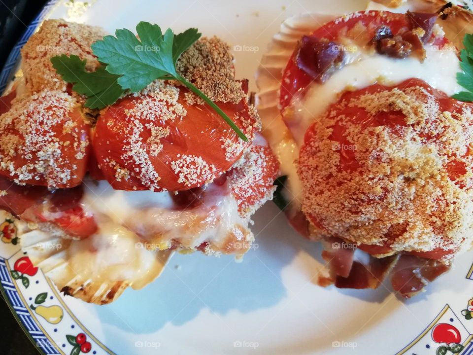 stuffed tomato with mozzarella and ground beef and baked in the oven