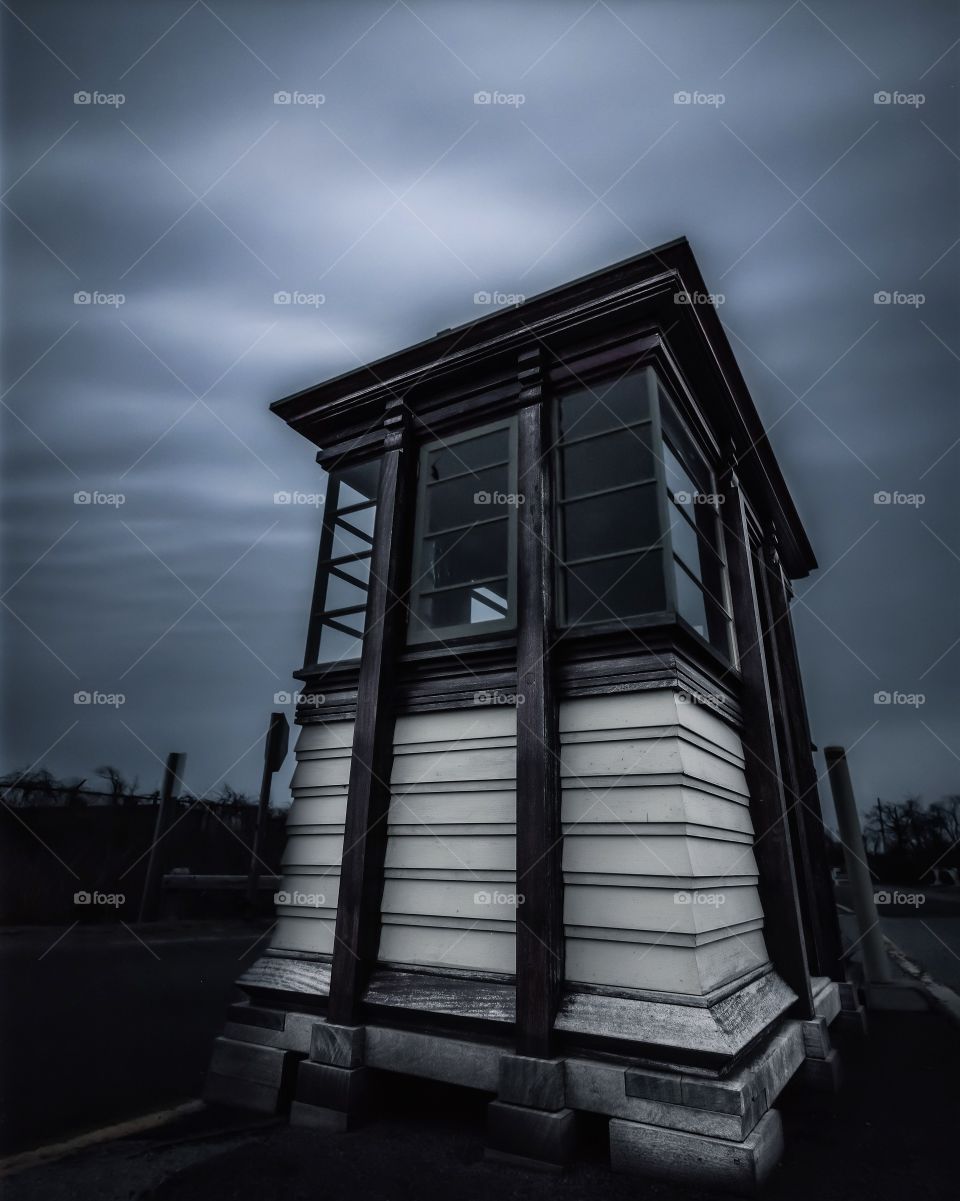 Dark stormy sky over an abandoned booth. 