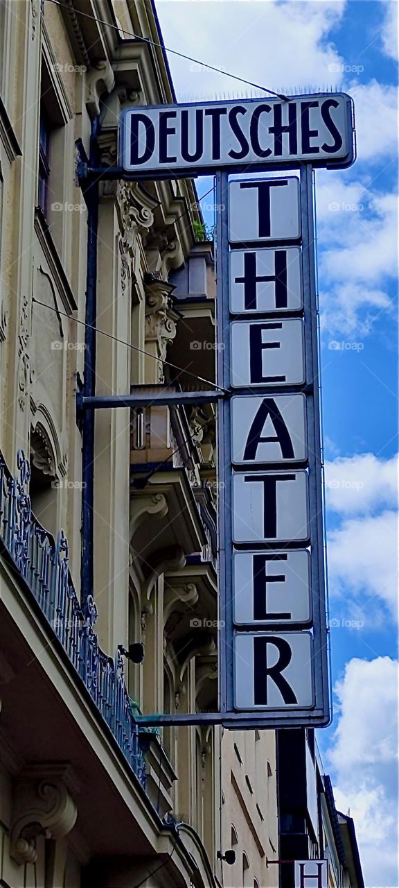This is the “DEUTSCHES THEATER”, the “GERMAN THEATER” sign outside the building featuring the show “FALCO” about the 1980s Viennese pop star singer. He became famous for the hit songs “Rock me Amadeus” and “Kommissar”. 2024. Hypnotic Productions