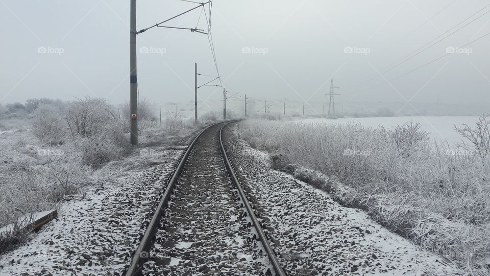 Empty railway track during winter