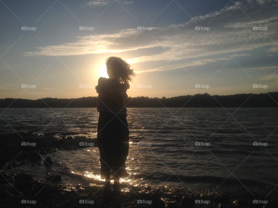 Girl Silhouette. Girl on the riverside of Danube.
