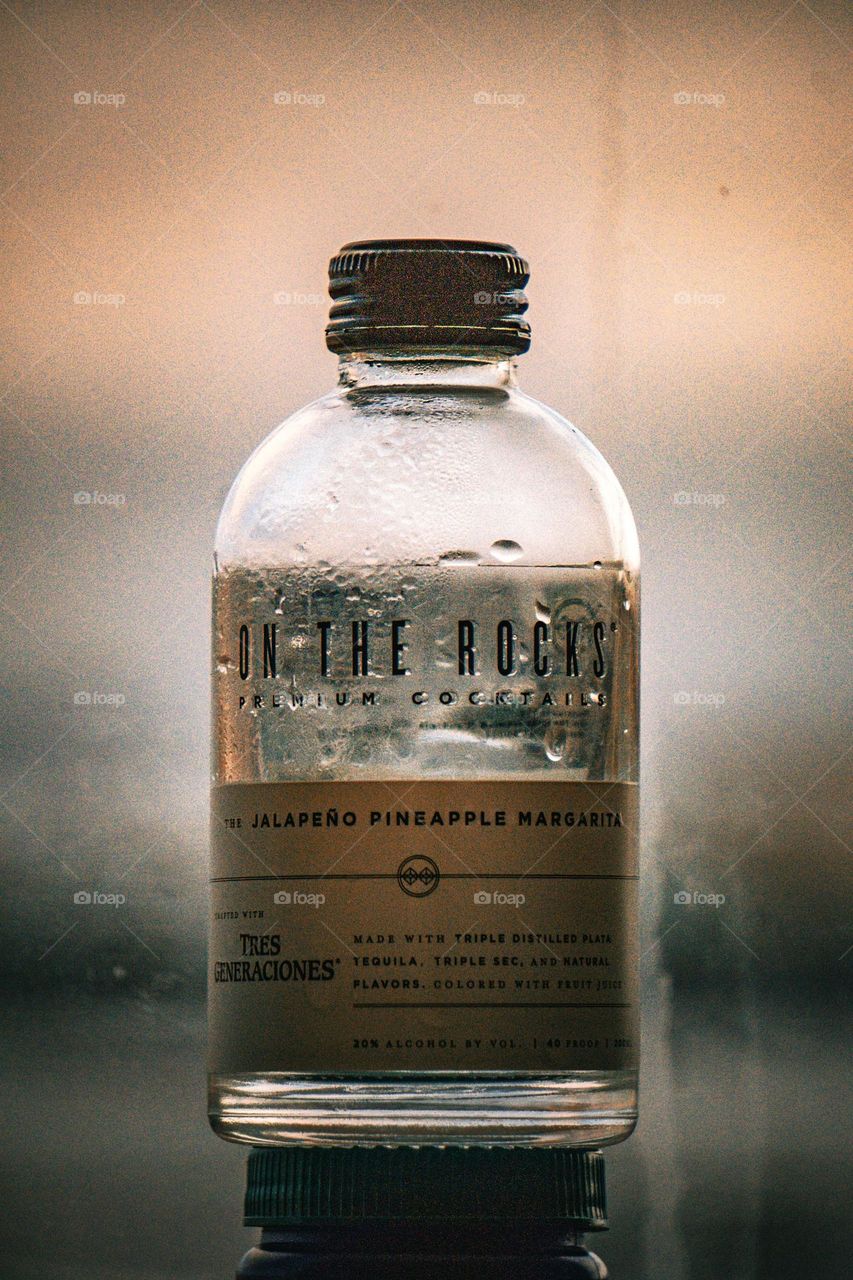 Empty bottle of on the rocks