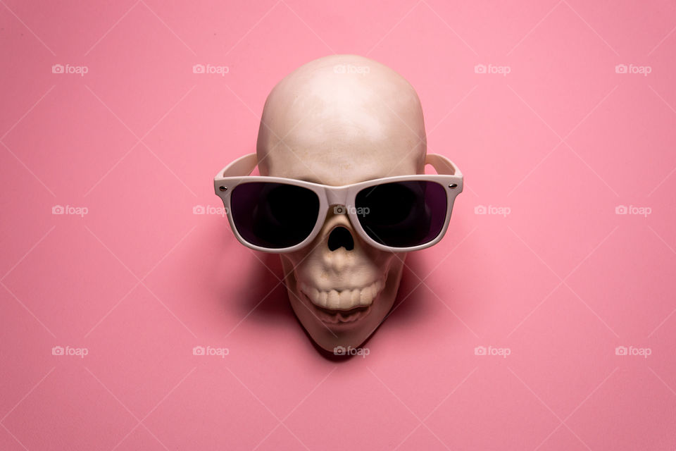 Skull on pink background. Creative medicine concept