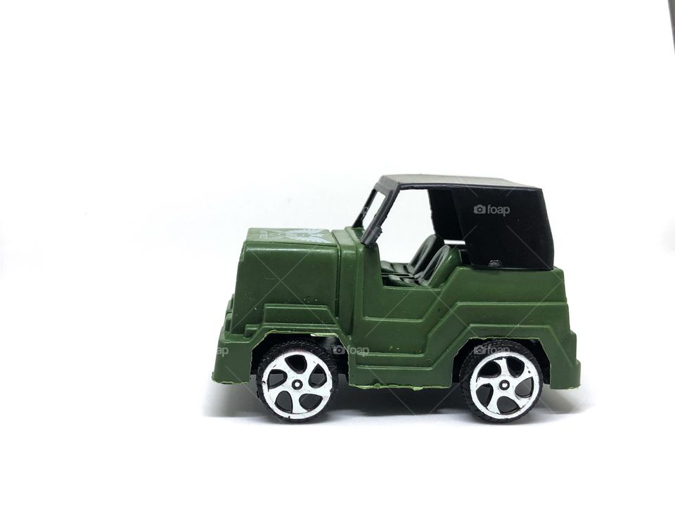 Military car toy on white background