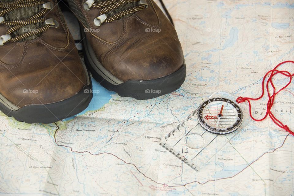 Hiking boots on a map