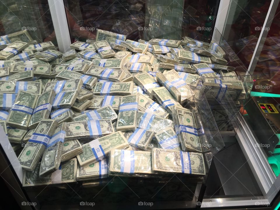 Cash money in a claw machine 