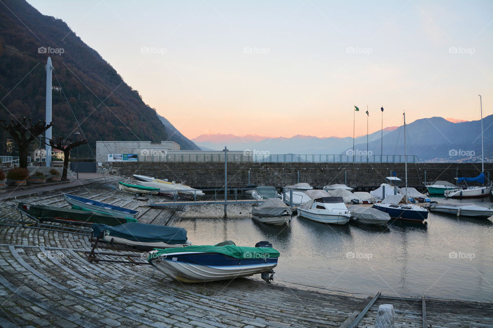 Sunset at the harbor of Argegno, Lake Como, Lombardy, Italy.