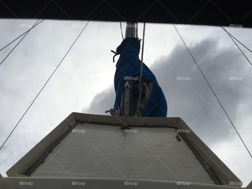The hutch cover of the „Salvation“, our sailboat seen from underneath looking up into a cloudy afternoon sky at Newtown Creek in Long Island City, Queens, NY in 2018. Hypnotic Productions