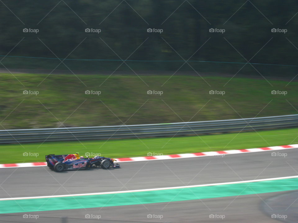 The car is at full speed around  Spa. 2010