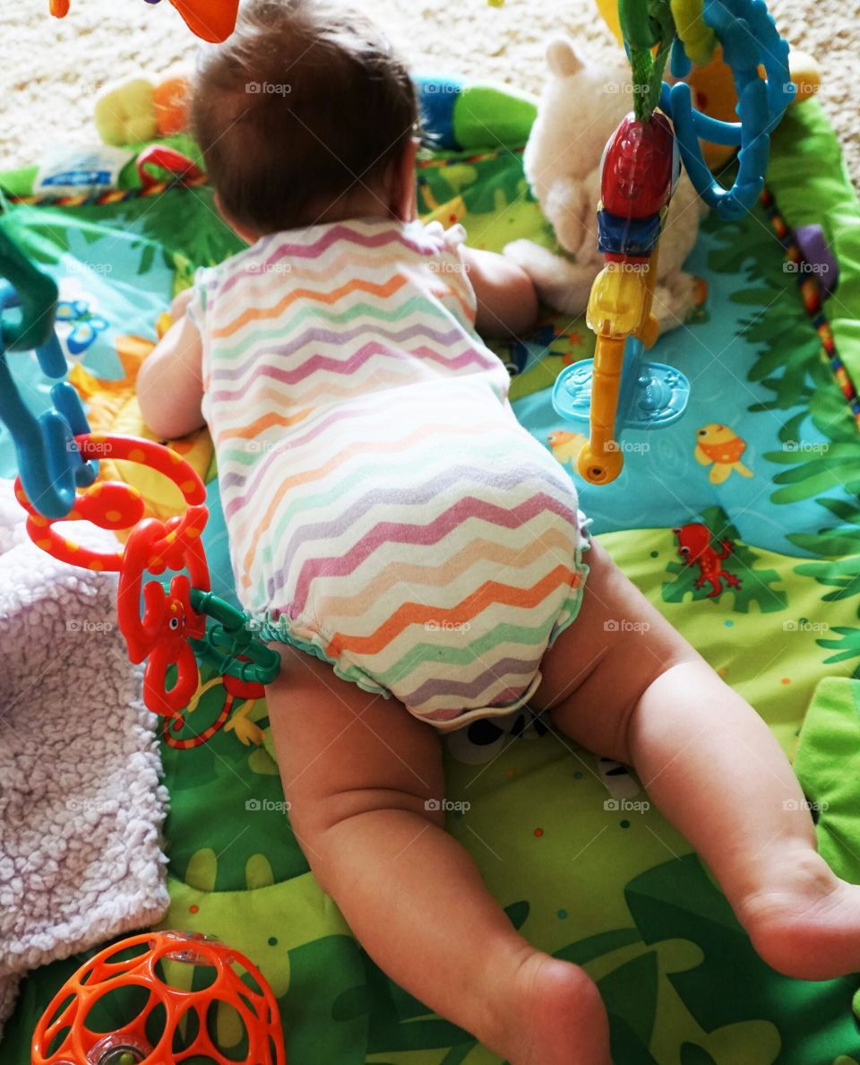 Tummy Time. Doctor says that 5 minutes of tummy time a day keep the leg rolls at bay!