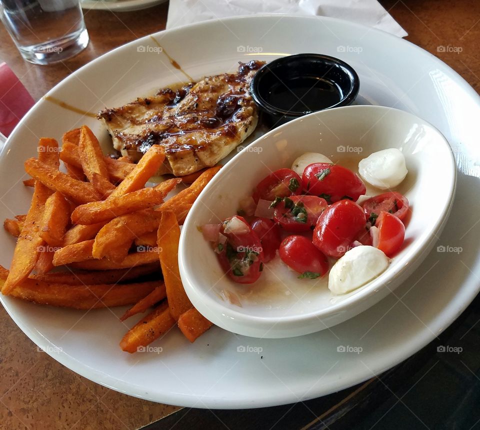 Jack Daniel's chicken with sweet potato fries and tomato and mozzarella salad at TGI Friday's