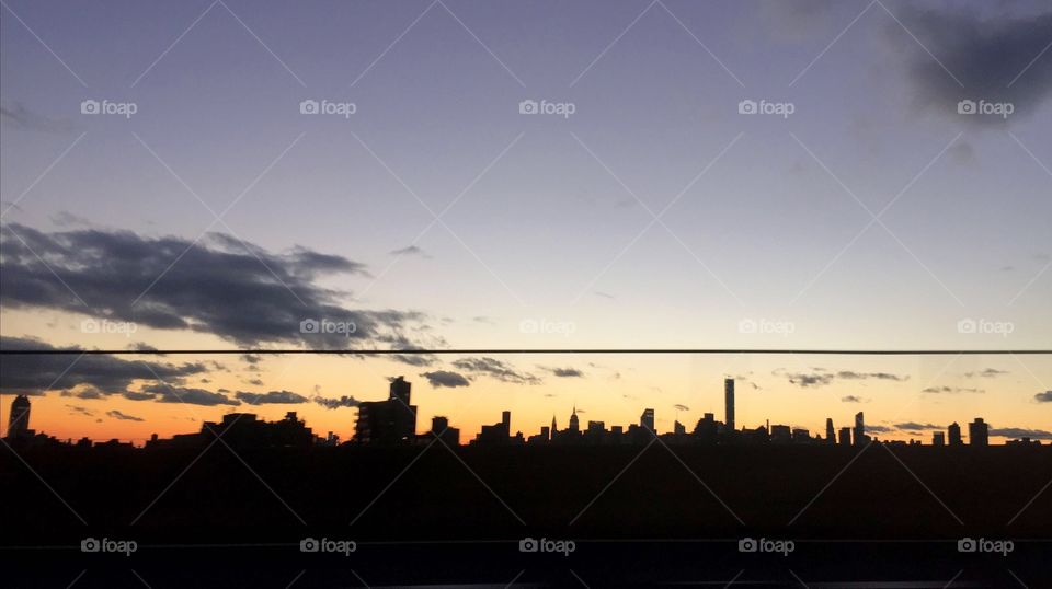 Warm skyline. Traveling over a bridge