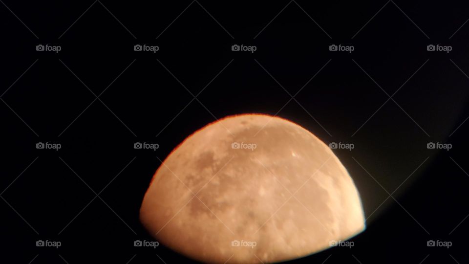 close up of moon through telescope
