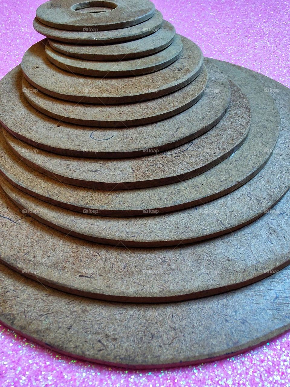 a pile of wooden circles.