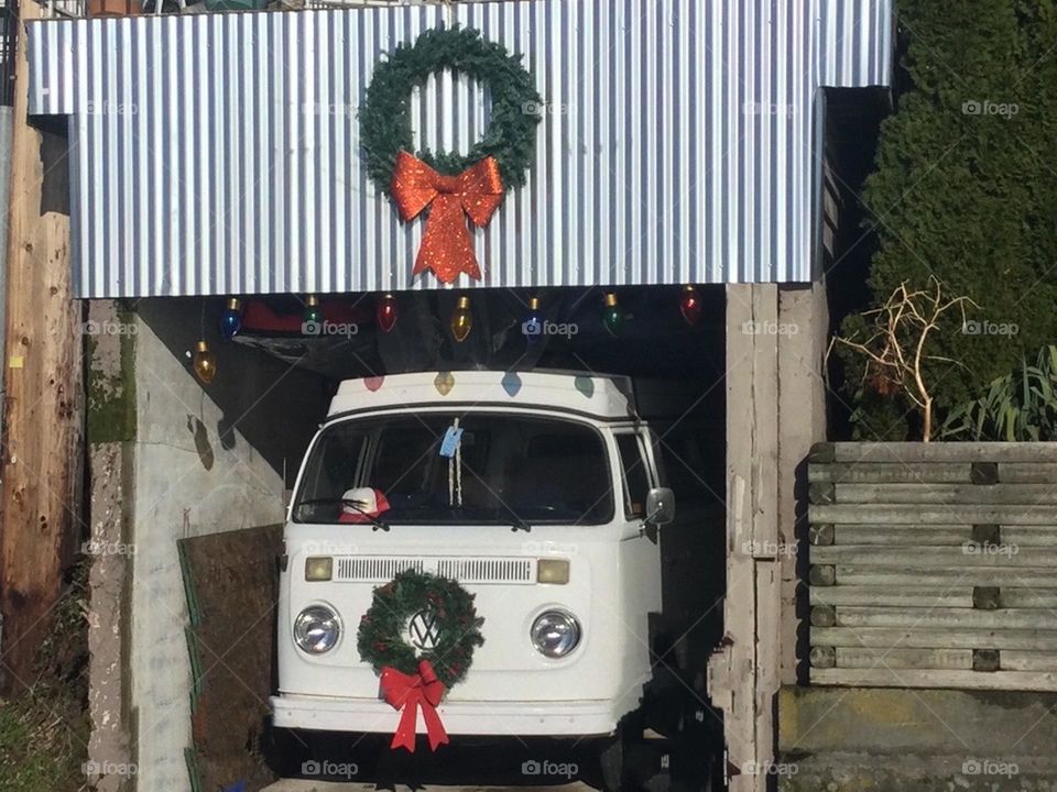 Old Whit Vintage Volkswagen Van in the Garage with a Christmas wreath on it