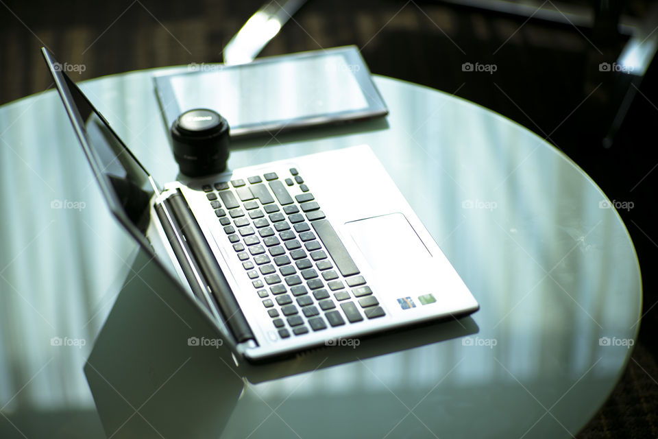 New era New technology New working tools. laptop tablet and lens