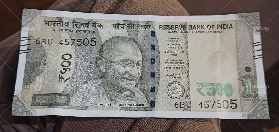 A Currency Note of Our Country... 
An  INR 500 ( Indian 500 Rupees Note) currency note having  Logo of Father of our nation called "Mahatma Ghandi" Ji  & Promising to pay the bearer a sum of Rs 500/ .
