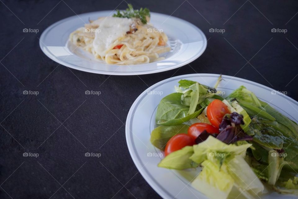 Salad and fettuccine alfredo