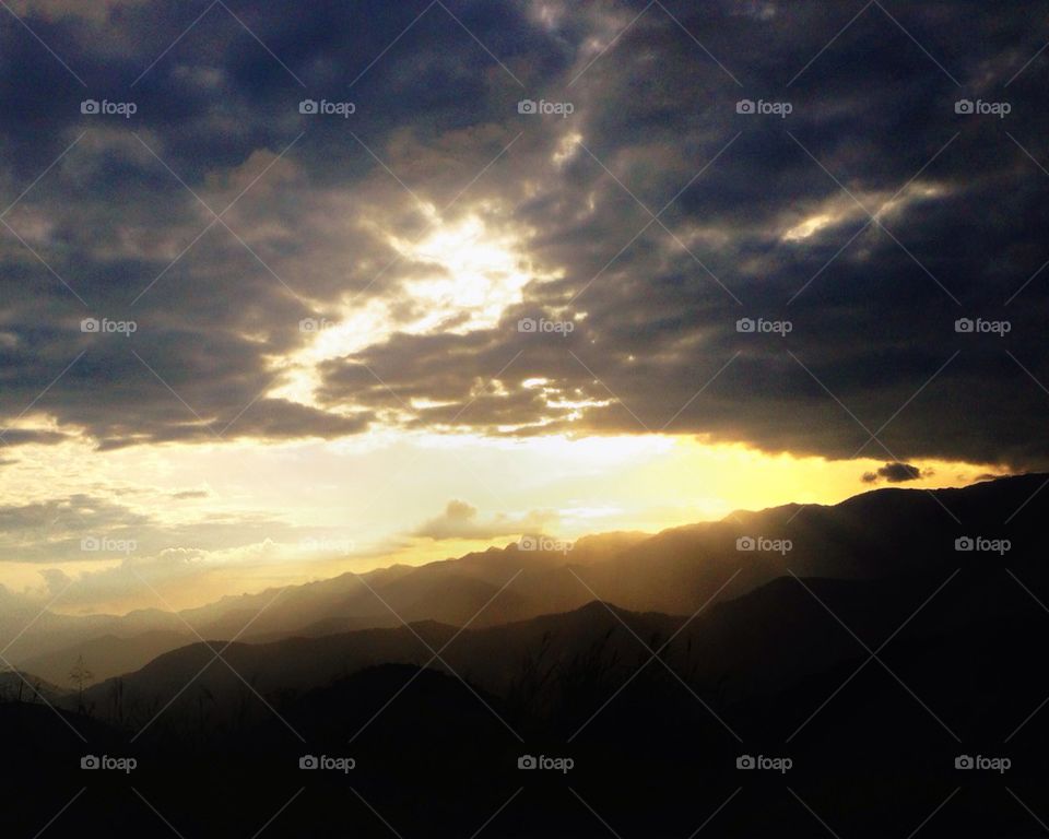 Sun behind the clouds