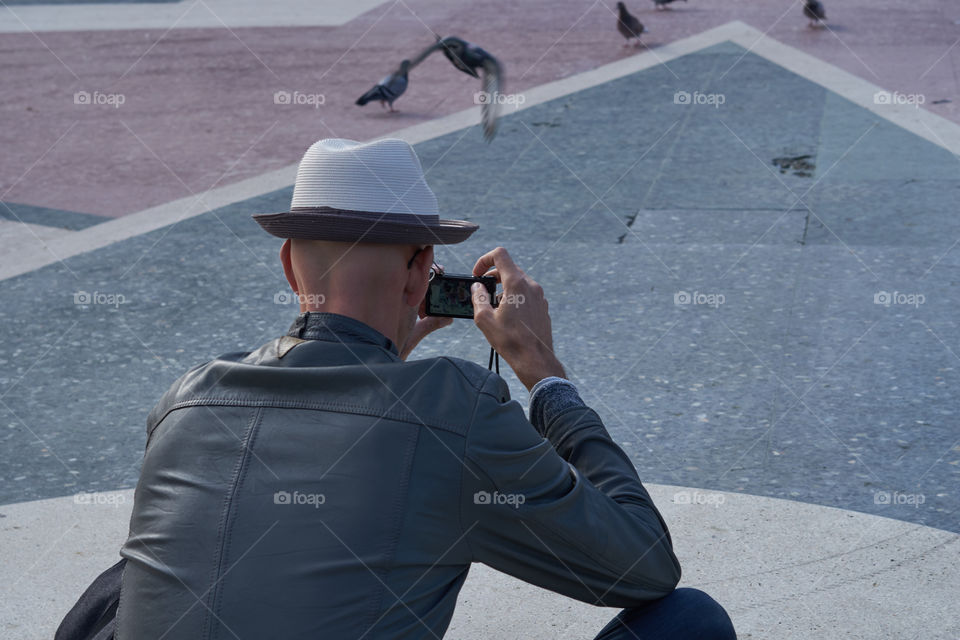 Grey Jacket, Grey Hat, Grey Pavement