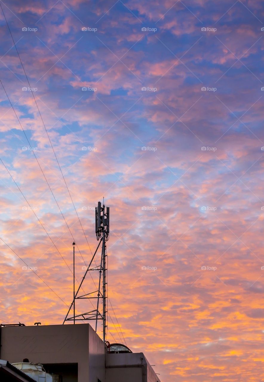 Telecom tower with golden cloud