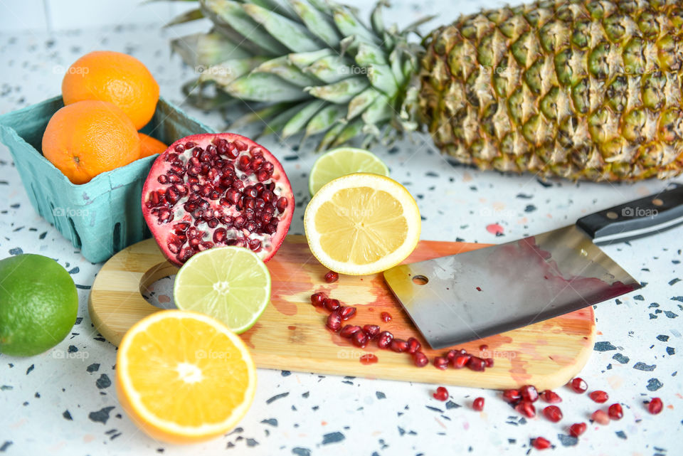 Close-up of cut up fruit on a wooden cutting board