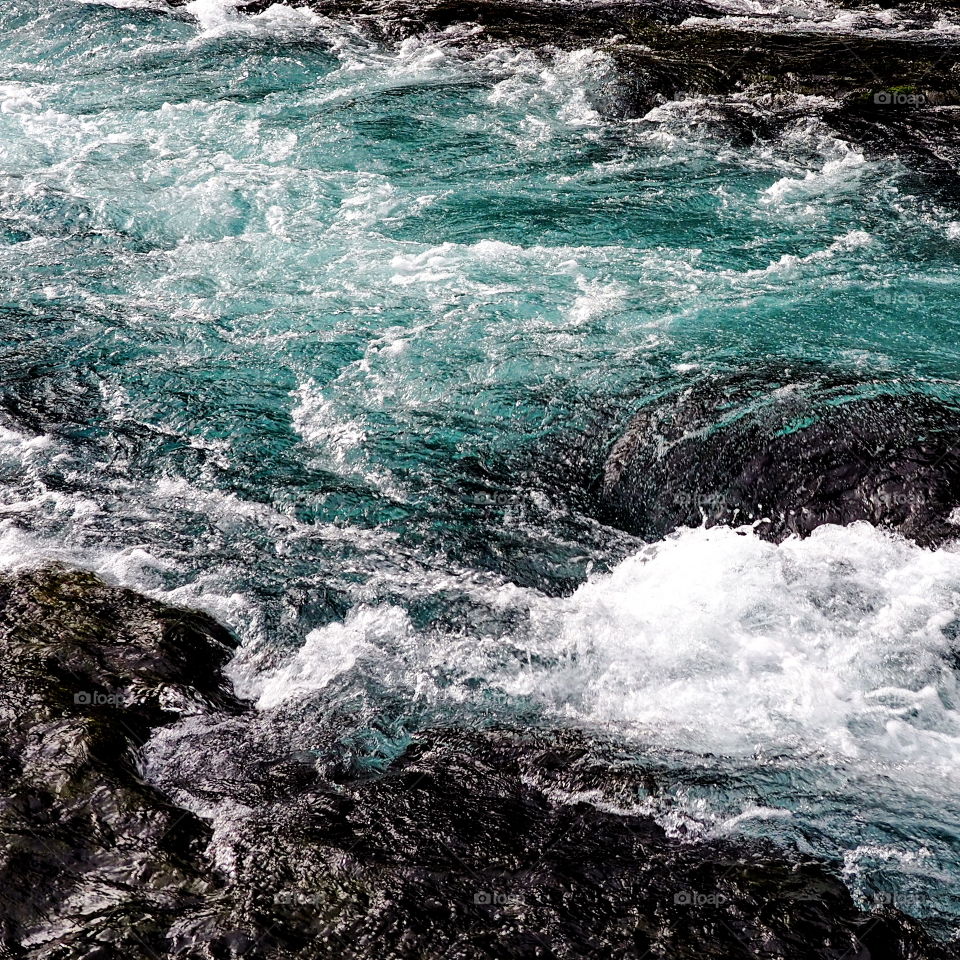 Wizard Falls on the Metolius River in Central Oregon show off their rich blue water in a channel on a cold winter day. 