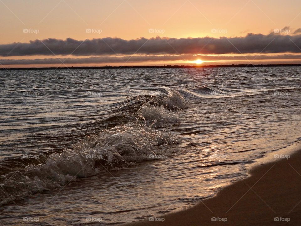 End of the day - Before the sun slivered below the horizon, it was kind enough to cast its reflection across the crashing waves.