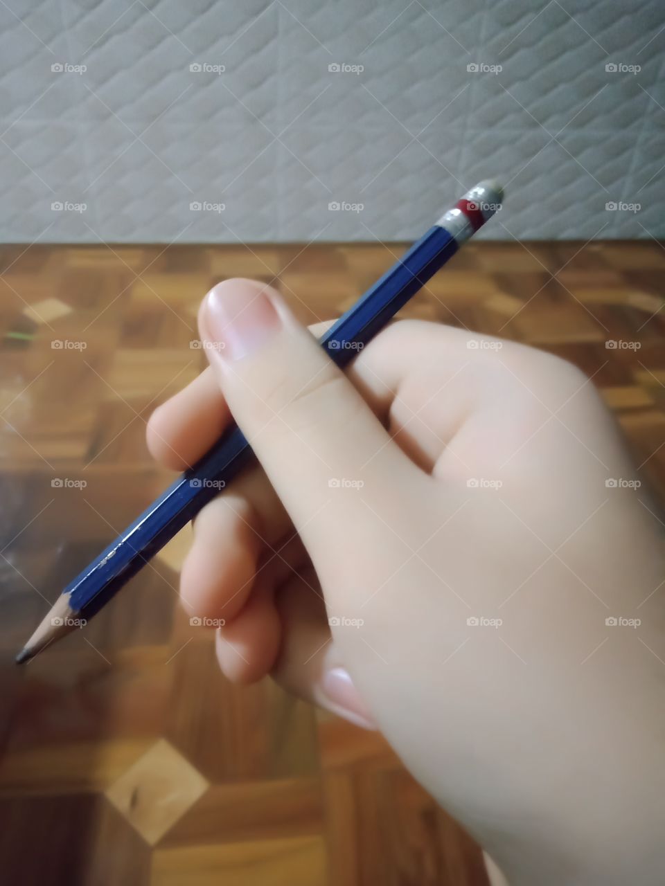 An artist hold his favourite pencil