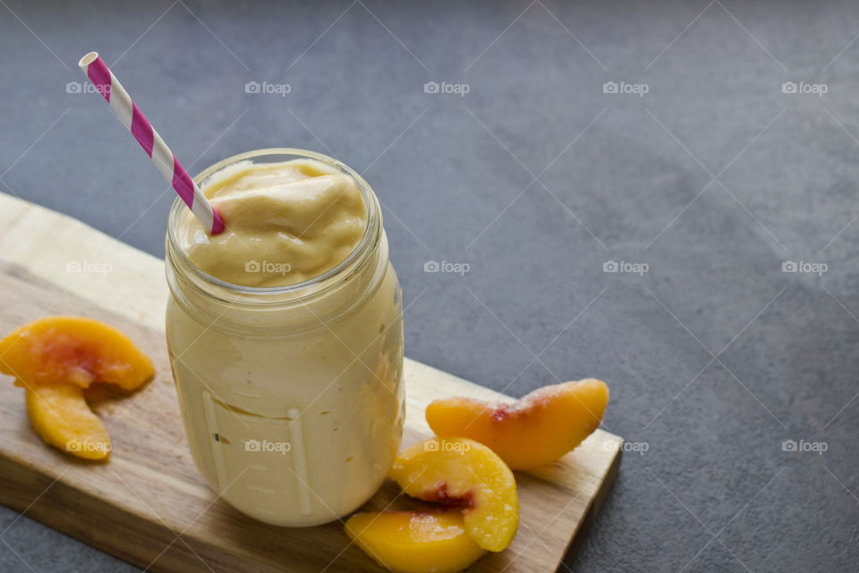 Peach Smoothie with straw