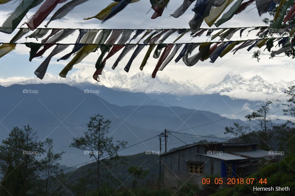 Snow mountain, greenary, trees, valley, prayer flags, windy atmosphere, natural beauty at Bhutan!