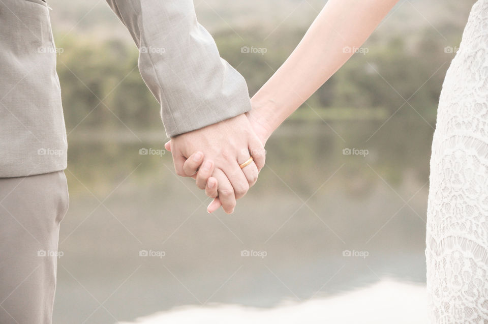 Close-up couple holding hand