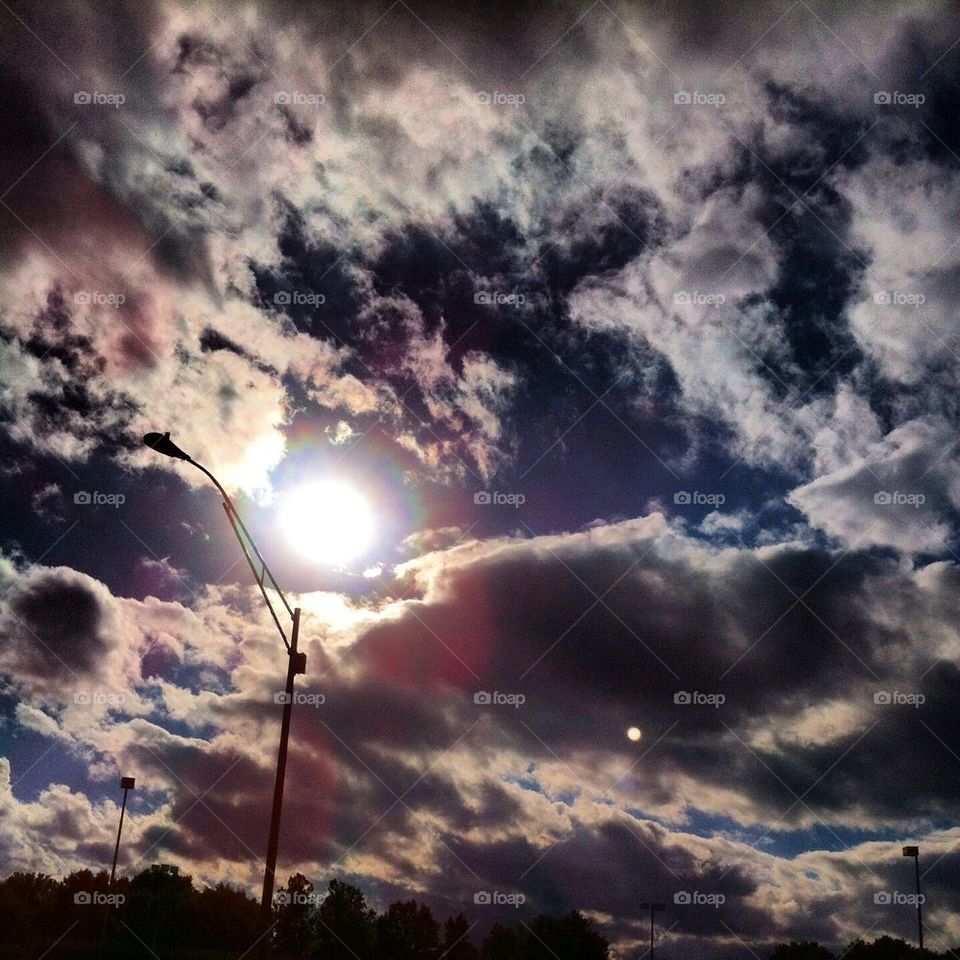 Sun and clouds and lamp