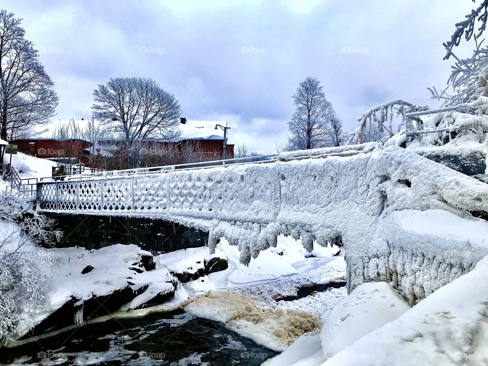 Frozen bridge at Vanhankaupunginkoski, Old town Helsinki Finland
