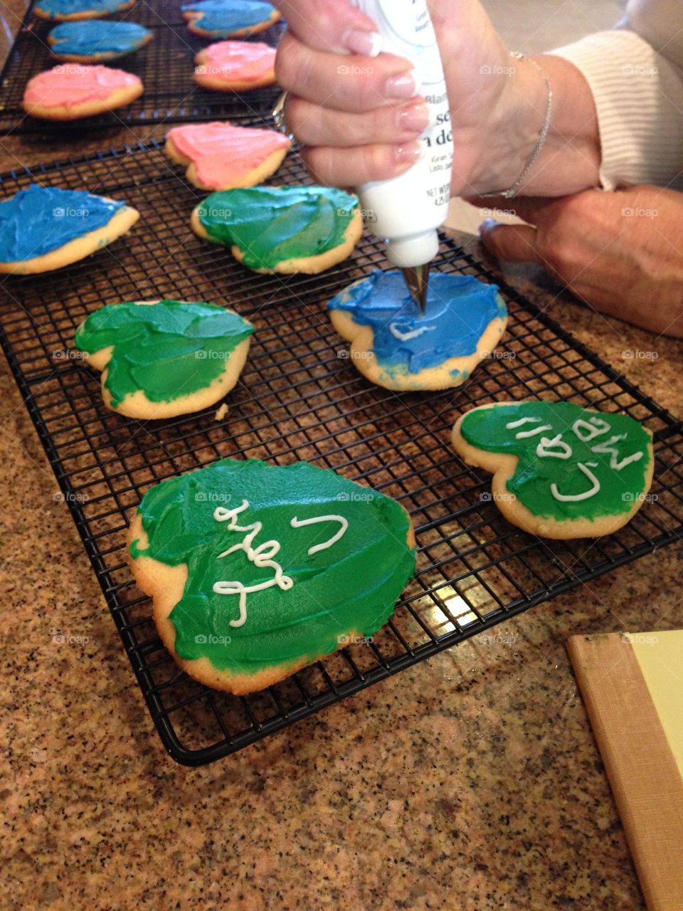 Colorful Baked cookies being decorated.