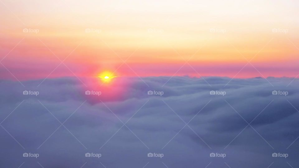 sunrise above the clouds