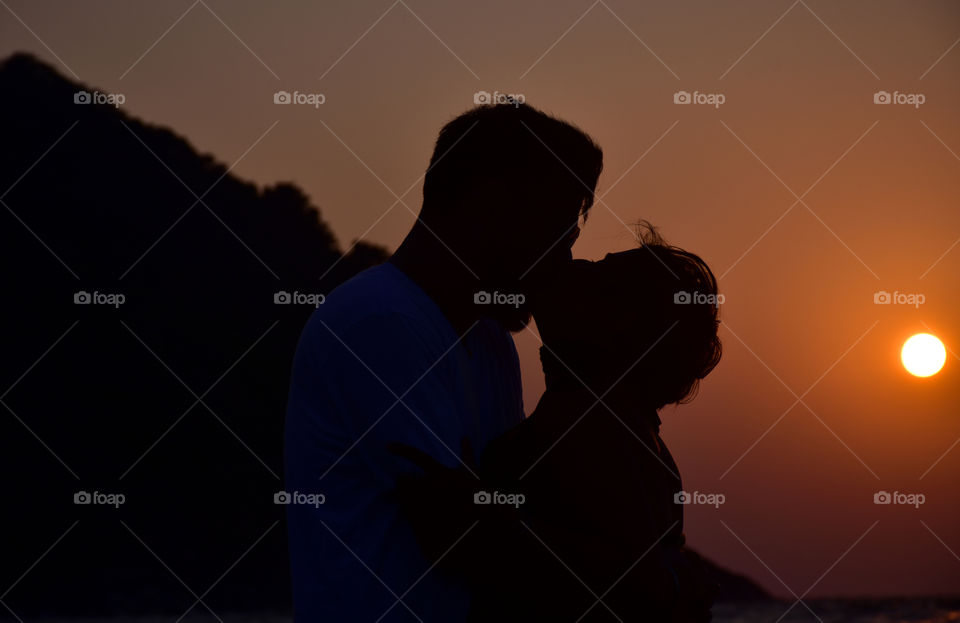 Love couple romance silhouette sunset kissing