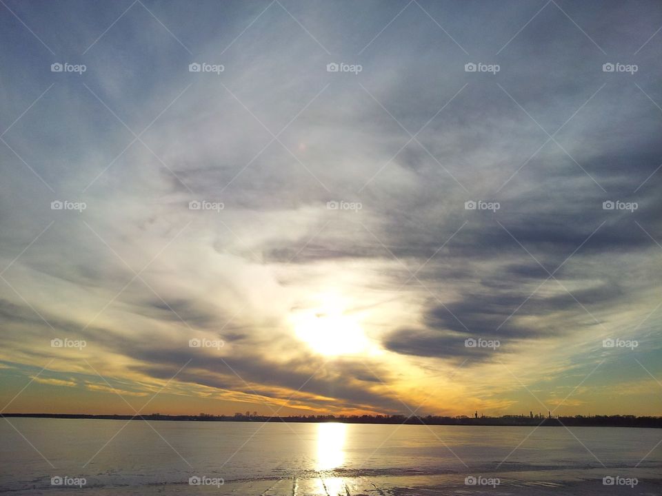 grayness of the day and dim the sun