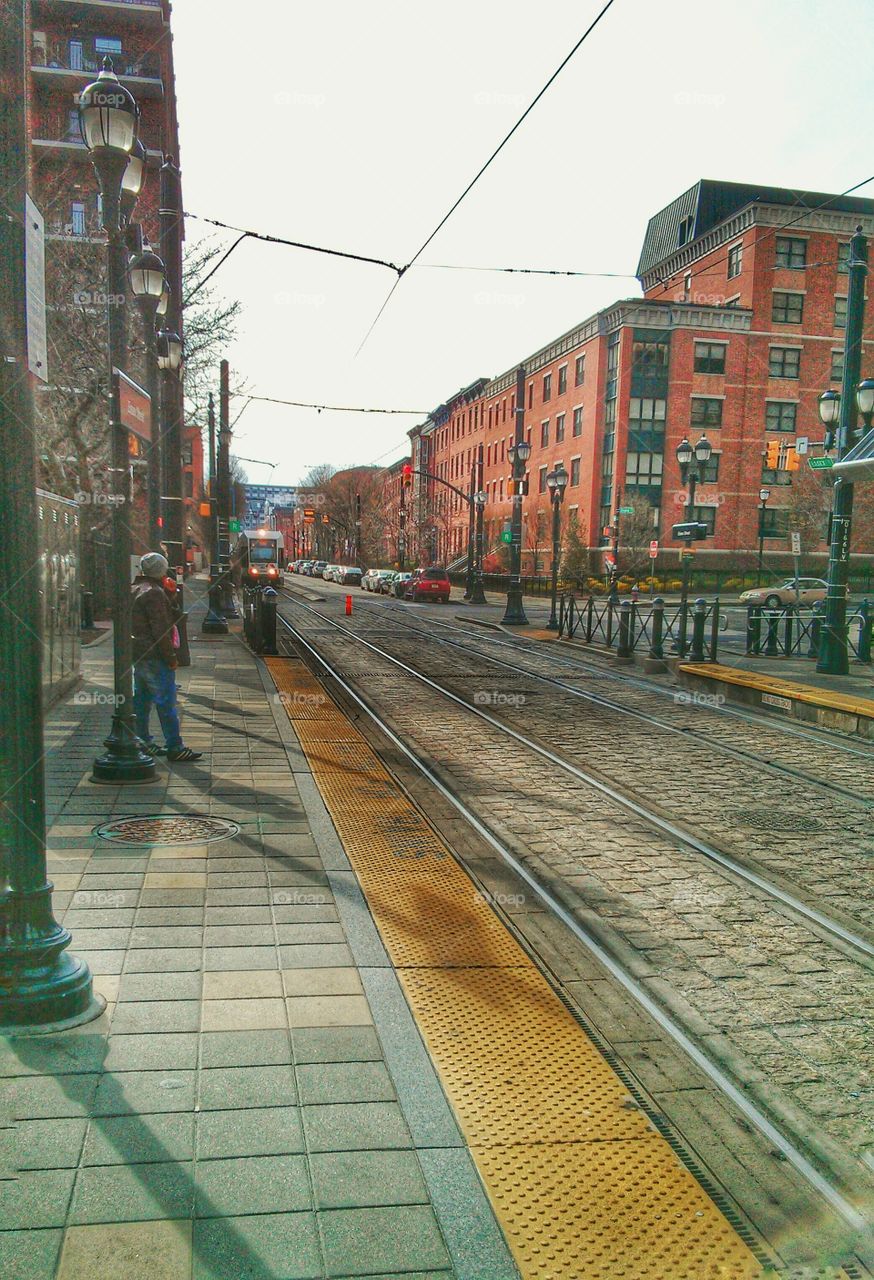 Chilly Spring Day at Light Rail Station. Waiting for the Hudson Bergen Light Rail in Jersey City, NJ