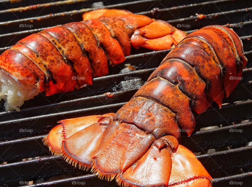 Cooking Lobster. Grilling Fresh Lobster Tails On A Barbecue
