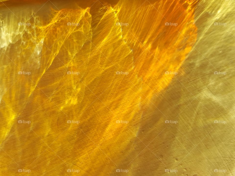 sunlight reflected through colored glass