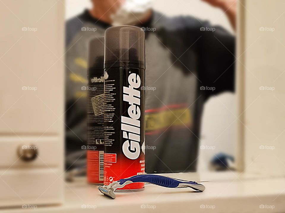 Man shaves his foamed beard, Gillette Products