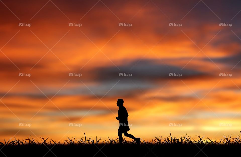 Silhouette of a boy running in nature 