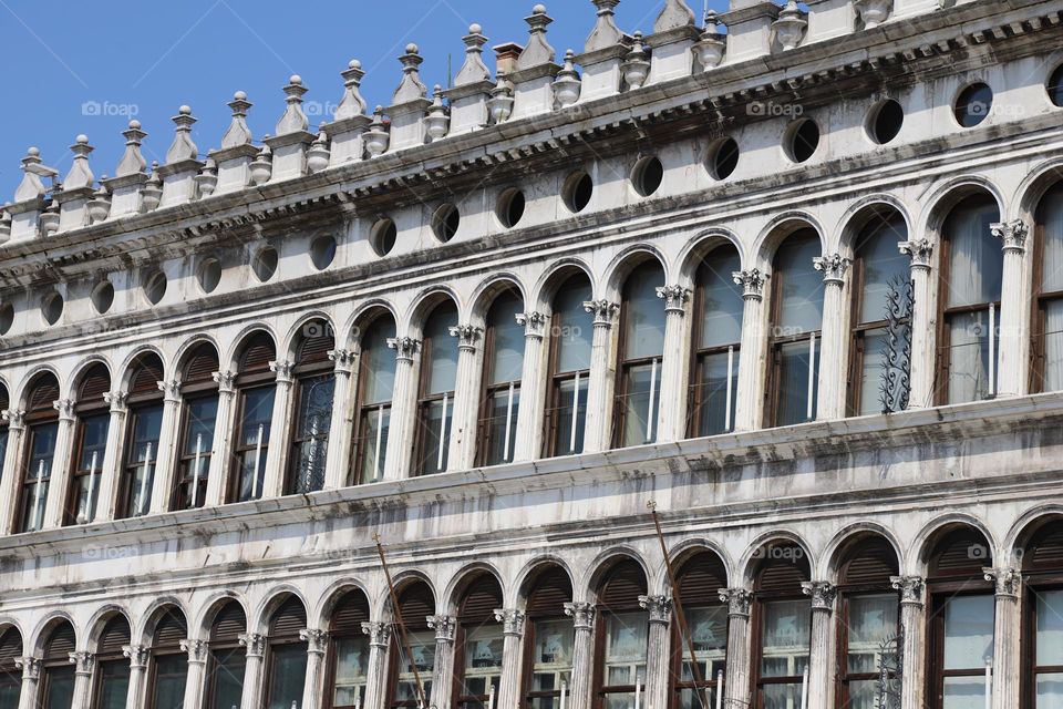 Pillars and windows on an old edifice 