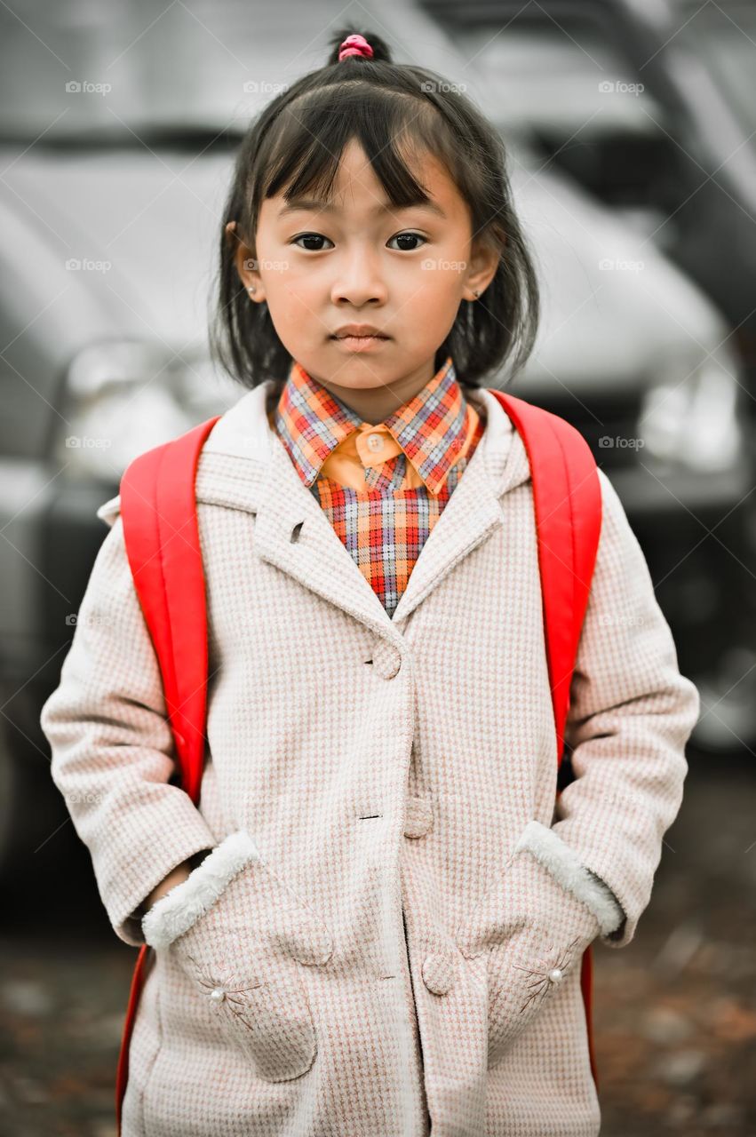 Capturing the emotion of a little girl while going to school.