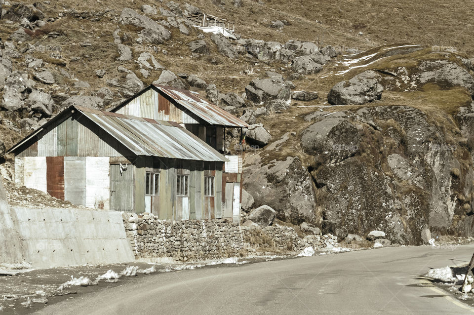 View of Military camp on a highway road side to Nathula Pass of India China border near Nathu La mountain pass in the Himalayas which connects Indian state Sikkim with China's Tibet Region.