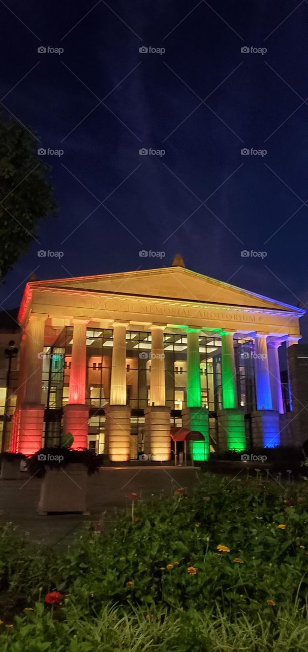 Duke Energy Center for Performing Arts in Raleigh lit up in rainbow colors for Pride