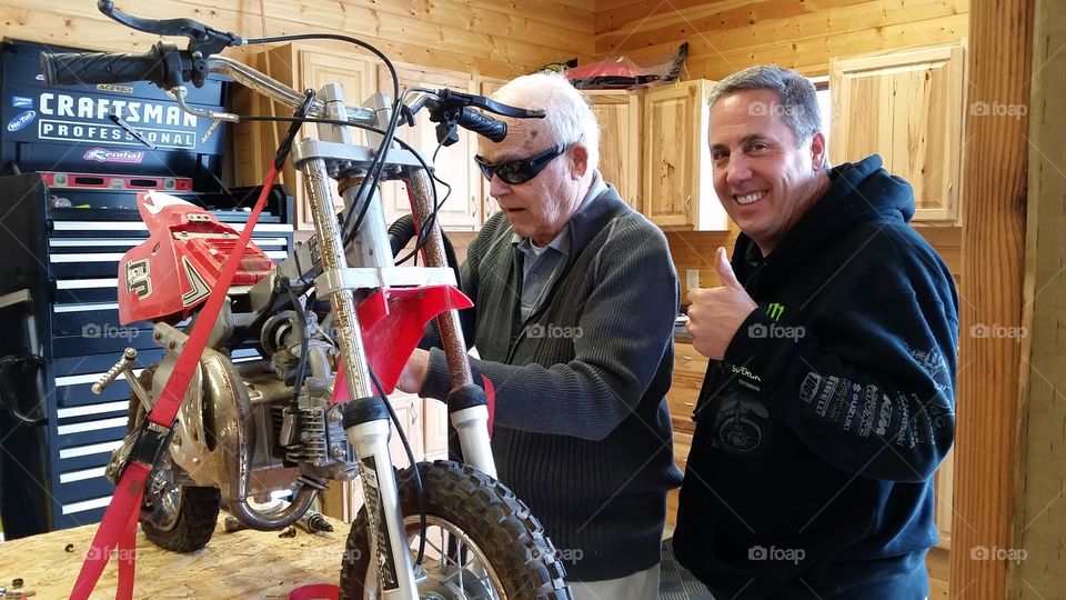 Father & son. Father with dementia helping 